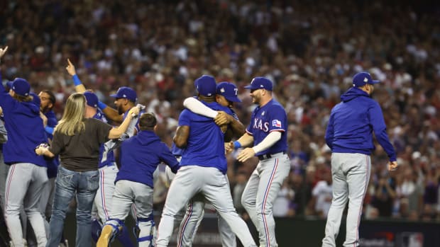 Nov 1, 2023; Phoenix, Arizona, USA; The Texas Rangers react after defeating the Arizona Diamondbacks in game five of the 2023 World Series at Chase Field. Mandatory Credit: Mark J. Rebilas-USA TODAY Sports